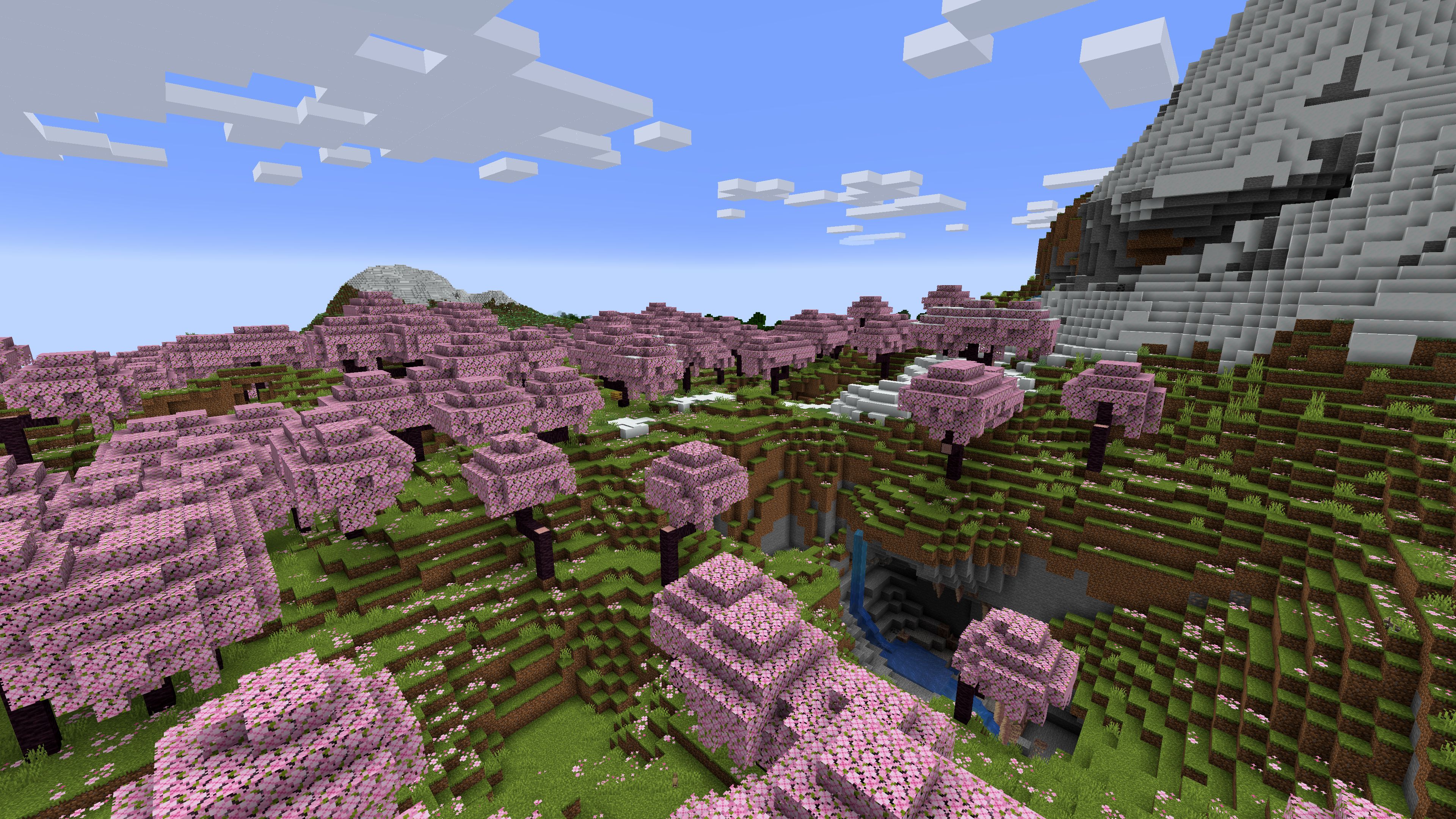 Graine de Minecraft 1.20 avec bosquet de fleurs de cerisier sur la montagne avec grotte
